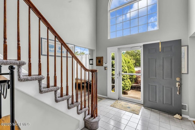 1771 Calico Ln, Toms River, NJ 08753 - foyer entrance with a high ceiling, baseboards, stairway, and light tile patterned floors