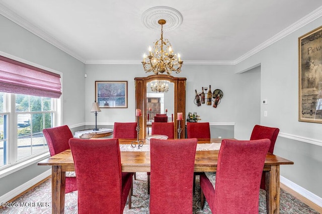 1771 Calico Ln, Toms River, NJ 08753 - dining area featuring a chandelier, baseboards, crown molding, and wood finished floors