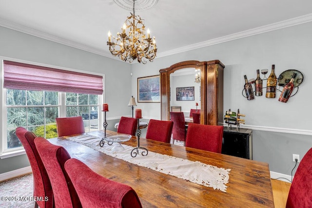 1771 Calico Ln, Toms River, NJ 08753 - dining area featuring a chandelier, baseboards, ornamental molding, and wood finished floors