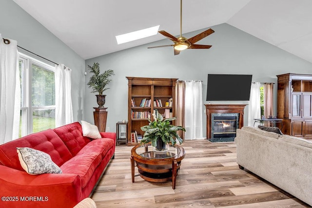 1771 Calico Ln, Toms River, NJ 08753 - living area with high vaulted ceiling, a ceiling fan, a skylight, a high end fireplace, and wood finished floors