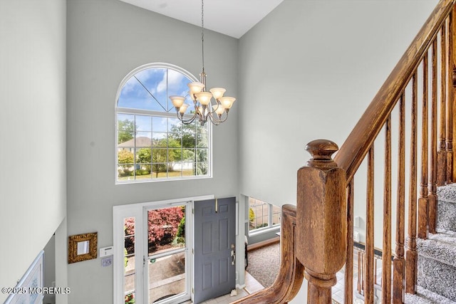 1771 Calico Ln, Toms River, NJ 08753 - foyer entrance featuring a high ceiling, stairway, and a chandelier