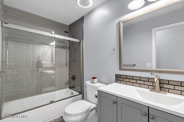 1771 Calico Ln, Toms River, NJ 08753 - full bath with toilet, vanity, tasteful backsplash, and combined bath / shower with glass door