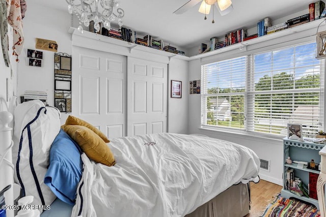1771 Calico Ln, Toms River, NJ 08753 - bedroom with light wood-style flooring, a closet, and a ceiling fan