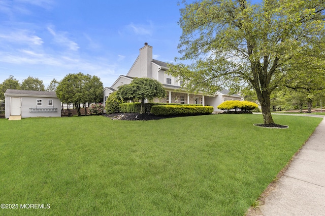 39 Sarah Ln, Howell, NJ 07731 - view of property exterior with a lawn and a chimney