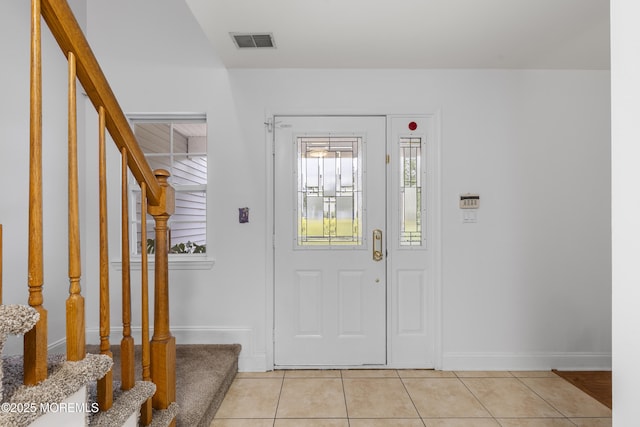 39 Sarah Ln, Howell, NJ 07731 - entrance foyer featuring stairs, light tile patterned flooring, and baseboards