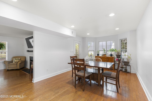 39 Sarah Ln, Howell, NJ 07731 - dining room with healthy amount of natural light, light wood-style flooring, a fireplace, baseboards, and recessed lighting