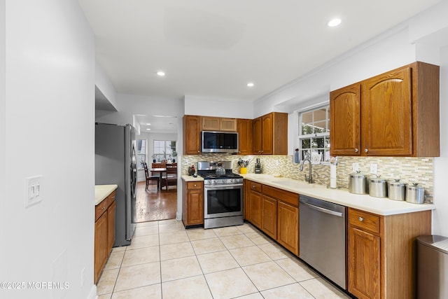 39 Sarah Ln, Howell, NJ 07731 - kitchen featuring appliances with stainless steel finishes, healthy amount of natural light, tasteful backsplash, a sink, and recessed lighting
