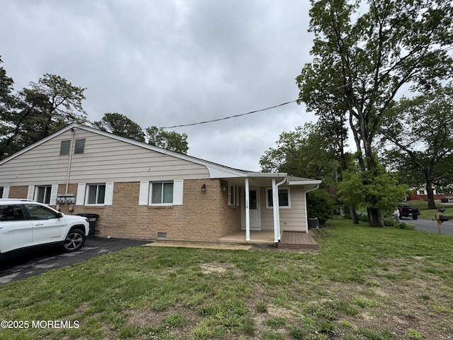 3B Blue Jay St, Manchester, NJ 08759 - view of front of property with a front lawn, covered porch, brick siding, and crawl space