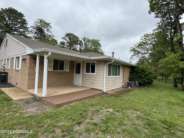 3B Blue Jay St, Manchester, NJ 08759 - back of house featuring a yard, central AC, brick siding, a patio, and roof with shingles