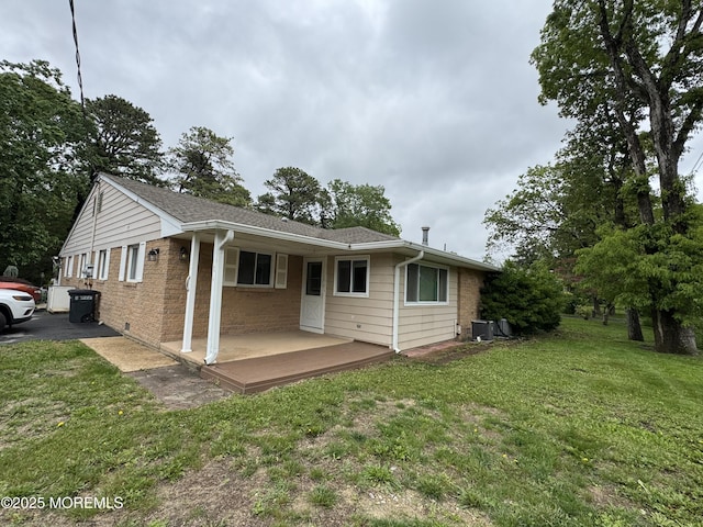 3B Blue Jay St, Manchester, NJ 08759 - view of front of home with a front yard, brick siding, and central AC