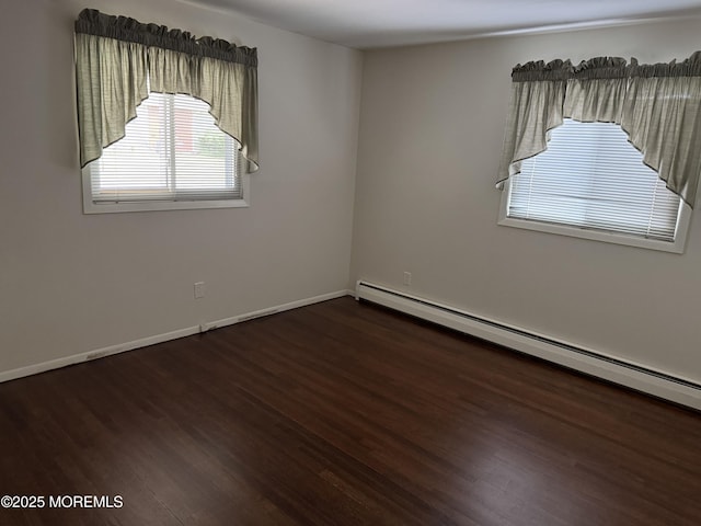3B Blue Jay St, Manchester, NJ 08759 - spare room featuring baseboard heating, healthy amount of natural light, wood finished floors, and baseboards