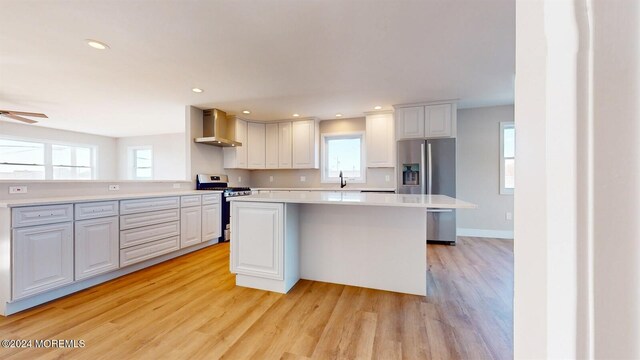 6 Lake Superior Dr, Little Egg Harbor, NJ 08087 - kitchen with stainless steel appliances, wall chimney exhaust hood, light wood-style floors, healthy amount of natural light, and recessed lighting