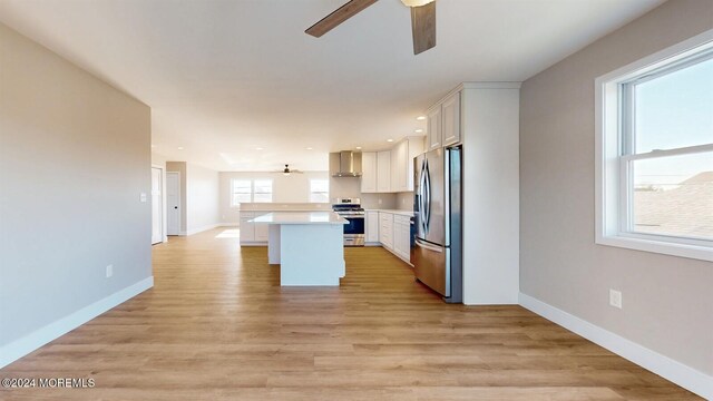 6 Lake Superior Dr, Little Egg Harbor, NJ 08087 - kitchen featuring appliances with stainless steel finishes, ceiling fan, light countertops, white cabinets, and a center island