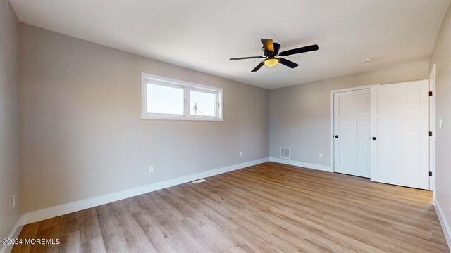 6 Lake Superior Dr, Little Egg Harbor, NJ 08087 - unfurnished bedroom featuring light wood finished floors, a closet, and ceiling fan