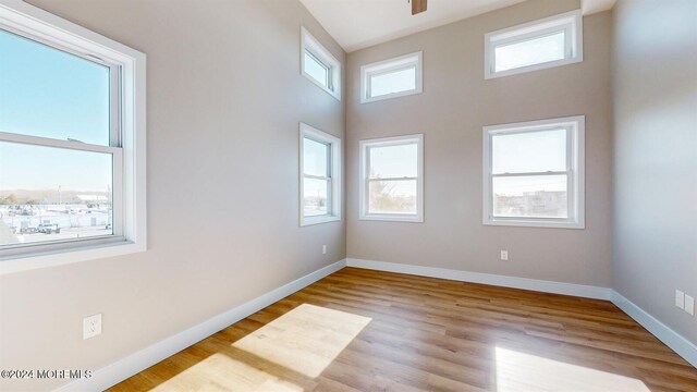 6 Lake Superior Dr, Little Egg Harbor, NJ 08087 - spare room featuring wood finished floors and a towering ceiling