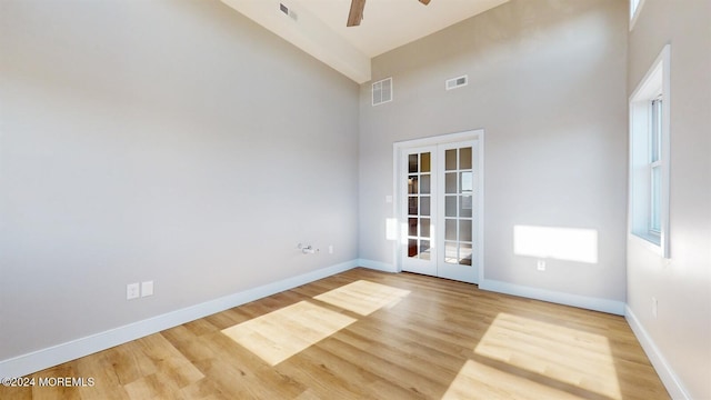 6 Lake Superior Dr, Little Egg Harbor, NJ 08087 - empty room with high vaulted ceiling, ceiling fan, french doors, and light wood finished floors