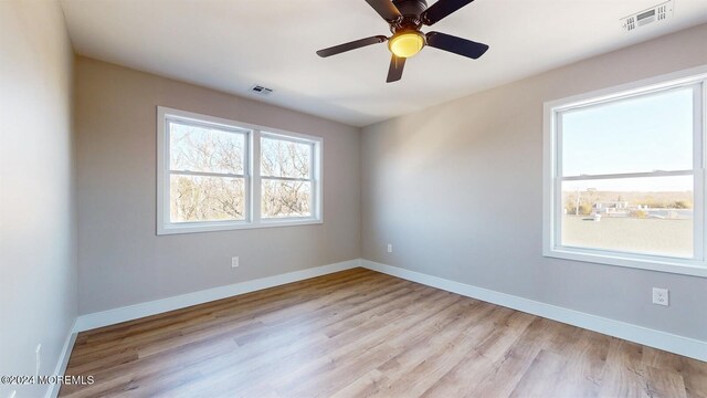 6 Lake Superior Dr, Little Egg Harbor, NJ 08087 - empty room with light wood-style floors and a ceiling fan