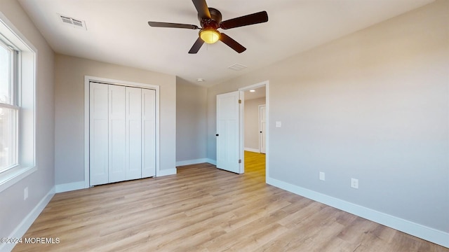 6 Lake Superior Dr, Little Egg Harbor, NJ 08087 - unfurnished bedroom with light wood-type flooring, a closet, and a ceiling fan
