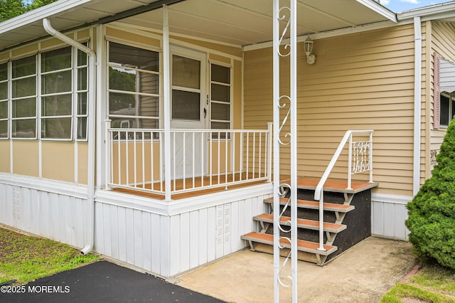 119 Village Rd, Morganville, NJ 07751 - entrance to property featuring covered porch and an attached carport