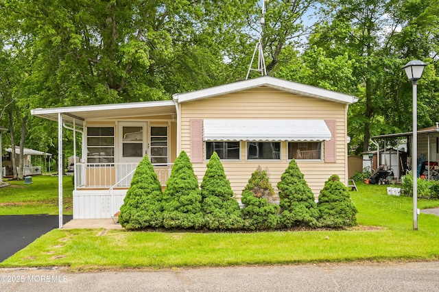 119 Village Rd, Morganville, NJ 07751 - manufactured / mobile home featuring a front yard