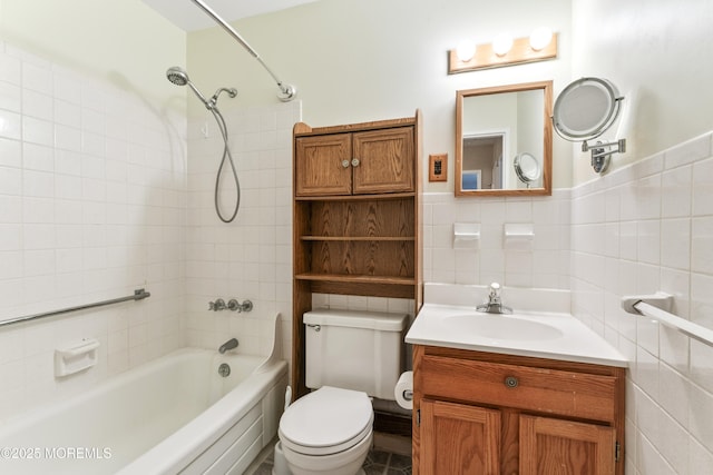 27 Cedar St Unit A, Toms River, NJ 08757 - full bathroom featuring tile walls, shower / bathtub combination, vanity, toilet, and a wainscoted wall