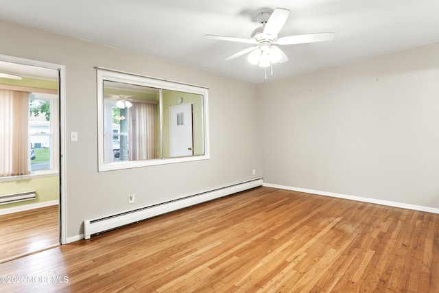 27 Cedar St Unit A, Toms River, NJ 08757 - unfurnished room with baseboard heating, light wood-type flooring, baseboards, and ceiling fan