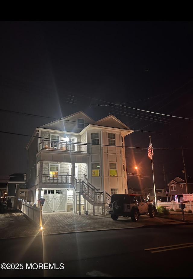 200 San Fernando Dr, Lavallette, NJ 08735 - property at night with stairs and an attached garage