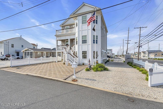 200 San Fernando Dr, Lavallette, NJ 08735 - view of front of house with a balcony, stairs, a porch, and a residential view
