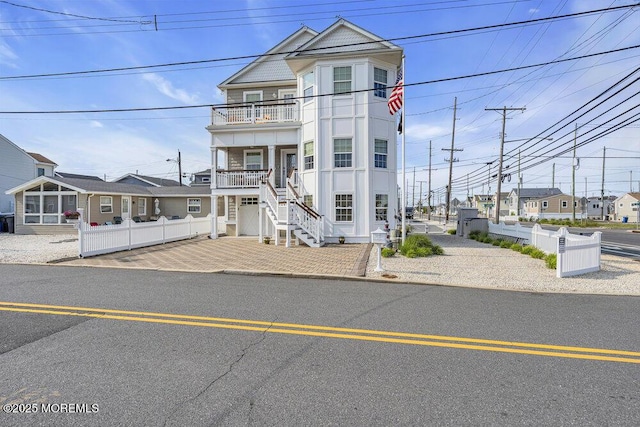 200 San Fernando Dr, Lavallette, NJ 08735 - view of front of home with a balcony, stairs, and a residential view