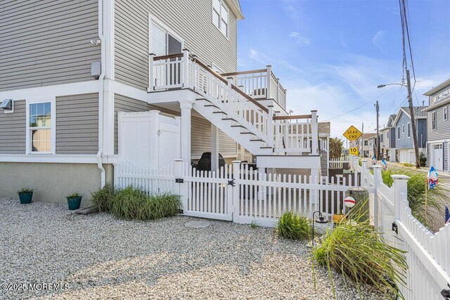200 San Fernando Dr, Lavallette, NJ 08735 - view of property exterior with a gate, stairs, a residential view, and a deck