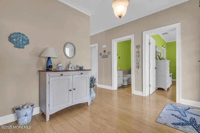 200 San Fernando Dr, Lavallette, NJ 08735 - entrance foyer featuring ornamental molding, baseboards, and light wood-style flooring