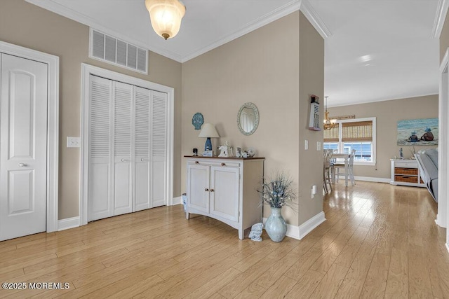 200 San Fernando Dr, Lavallette, NJ 08735 - corridor featuring a chandelier, light wood finished floors, ornamental molding, and baseboards
