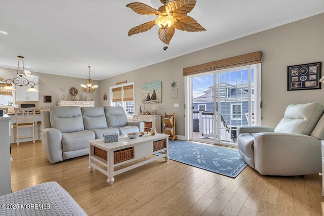 200 San Fernando Dr, Lavallette, NJ 08735 - living room featuring light wood-style floors, plenty of natural light, ceiling fan, and ornamental molding
