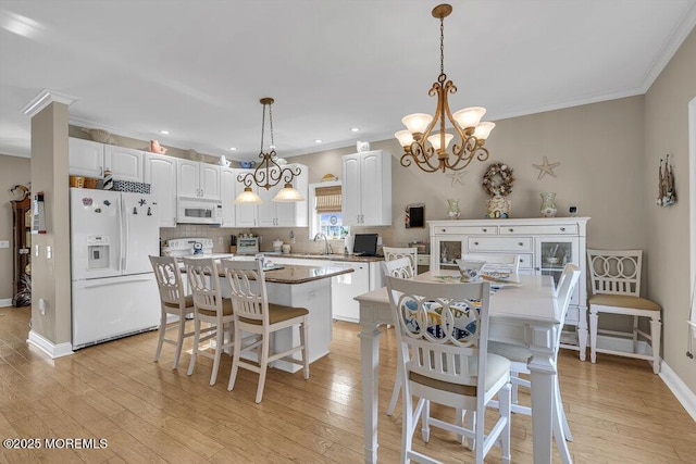 200 San Fernando Dr, Lavallette, NJ 08735 - dining room with crown molding, light wood-style flooring, a chandelier, baseboards, and recessed lighting
