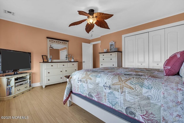 200 San Fernando Dr, Lavallette, NJ 08735 - bedroom featuring a closet, light wood finished floors, ornamental molding, baseboards, and a ceiling fan