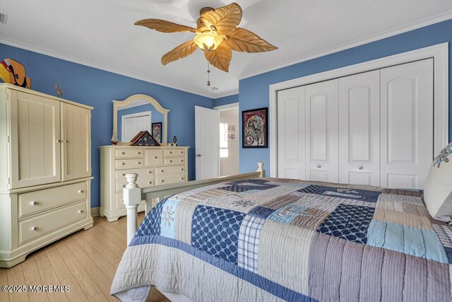 200 San Fernando Dr, Lavallette, NJ 08735 - bedroom with a closet, light wood-style flooring, crown molding, ceiling fan, and baseboards