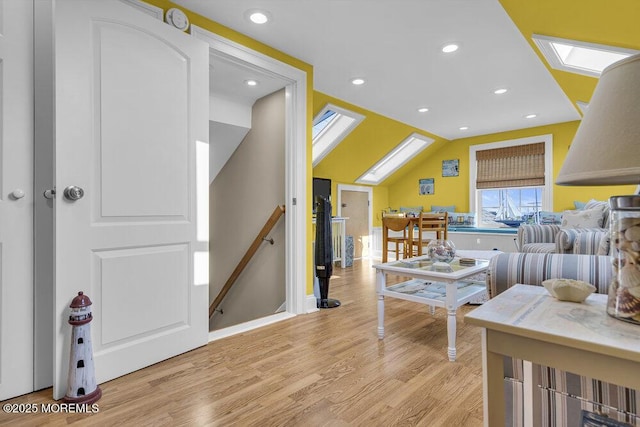 200 San Fernando Dr, Lavallette, NJ 08735 - living room featuring a skylight, light wood-style floors, recessed lighting, and vaulted ceiling