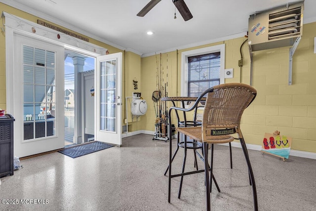200 San Fernando Dr, Lavallette, NJ 08735 - interior space featuring a heating unit, a ceiling fan, baseboards, ornamental molding, and concrete block wall