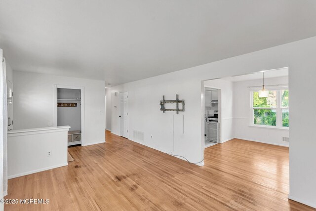 824 Broadway Blvd, Toms River, NJ 08757 - unfurnished living room featuring light wood finished floors and baseboards