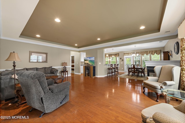 12 Stemson Ct, Little Egg Harbor, NJ 08087 - living room with a raised ceiling, a chandelier, wood finished floors, recessed lighting, and ornamental molding