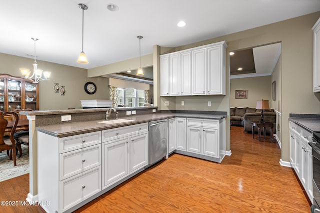 12 Stemson Ct, Little Egg Harbor, NJ 08087 - kitchen featuring stainless steel appliances, a sink, a peninsula, dark countertops, and recessed lighting