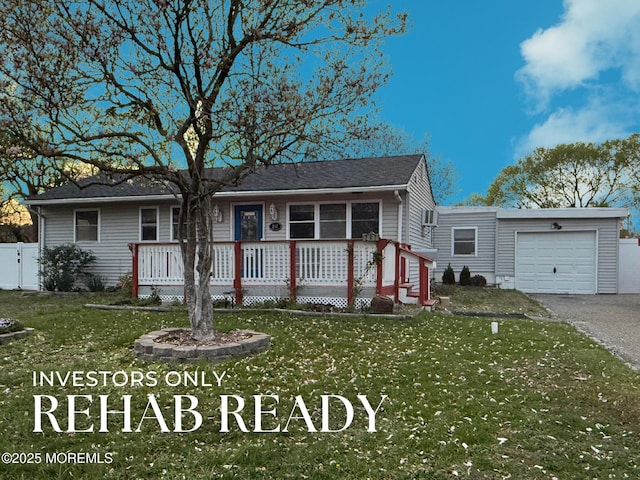 247 Cottonwood Dr, Brick, NJ 08723 - ranch-style home with an attached garage, asphalt driveway, and a porch