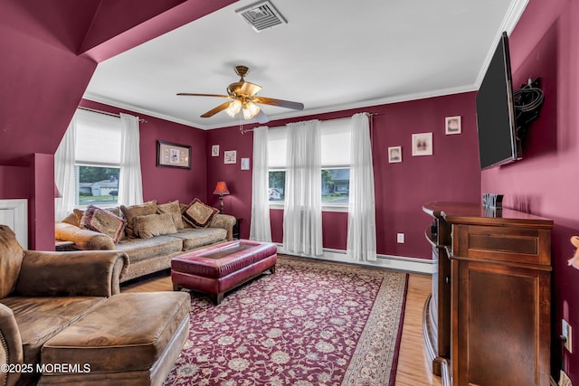 2 Miriam Dr, Matawan, NJ 07747 - living room featuring healthy amount of natural light, a ceiling fan, wood finished floors, crown molding, and baseboards