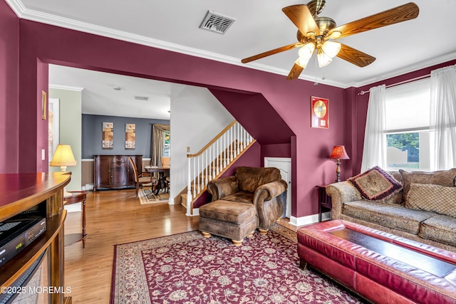 2 Miriam Dr, Matawan, NJ 07747 - living room featuring wood finished floors, ceiling fan, stairs, ornamental molding, and baseboards