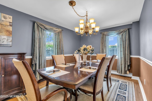 2 Miriam Dr, Matawan, NJ 07747 - dining room with a chandelier, a baseboard heating unit, light wood-style flooring, and baseboards