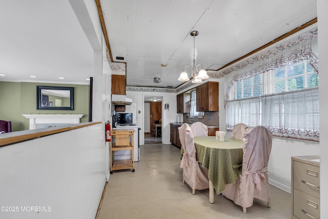2 Miriam Dr, Matawan, NJ 07747 - dining area with a chandelier, a fireplace, and light floors
