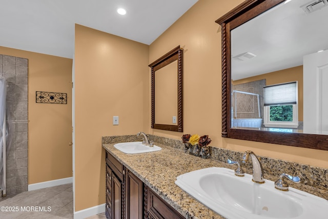 2 Miriam Dr, Matawan, NJ 07747 - bathroom featuring double vanity, tiled shower, tile patterned floors, and baseboards