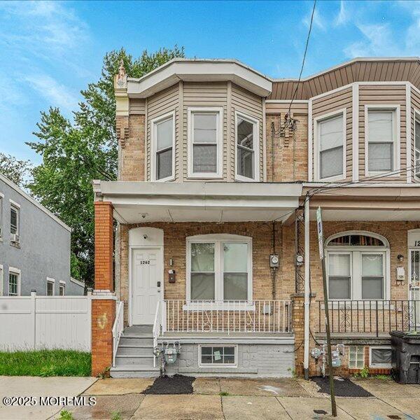 1262 Thurman St, Camden, NJ 08104 - view of property featuring covered porch and brick siding
