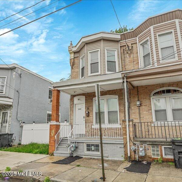 1262 Thurman St, Camden, NJ 08104 - multi unit property featuring covered porch and brick siding