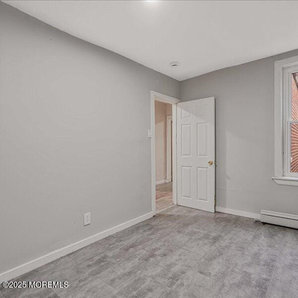 1262 Thurman St, Camden, NJ 08104 - unfurnished room with baseboards and a baseboard heating unit